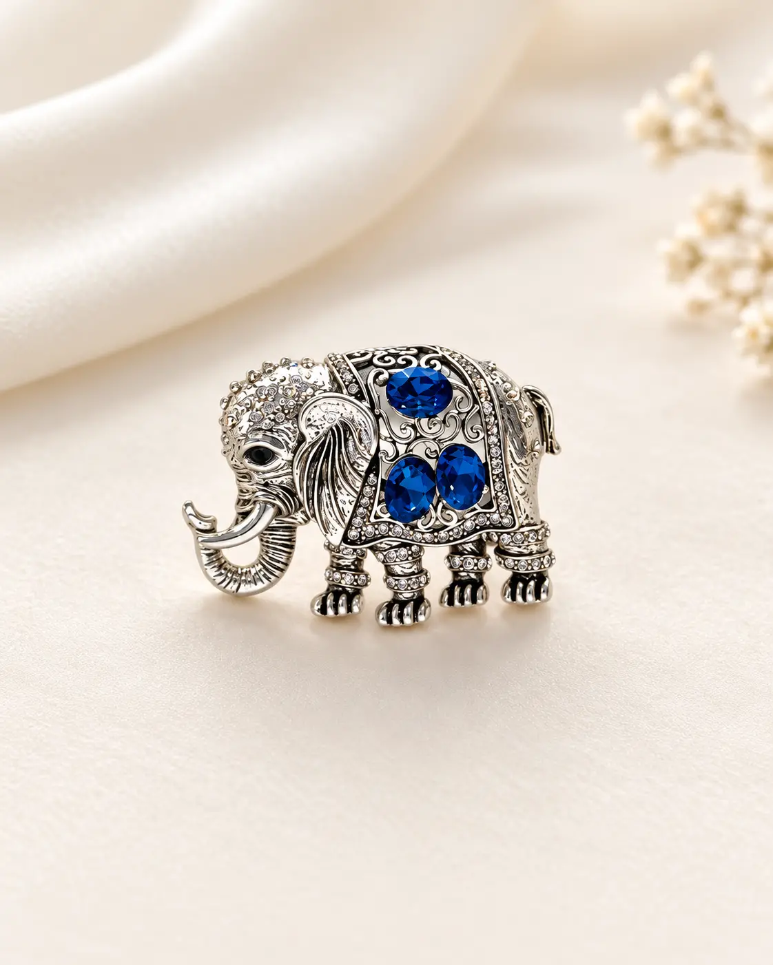 Silver-Tone Elephant Brooch with Deep Blue Stone Accents